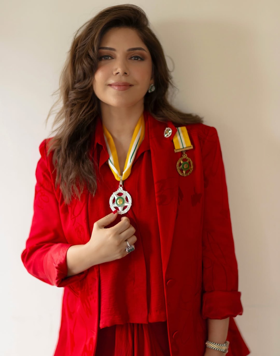 Hadiqa Kiani in the garden, wearing the Sitara-i-Imtiaz medal